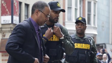 Officer Caesar Goodson, left, one of six Baltimore city police officers charged in connection to the death of Freddie Gray.