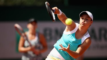 Ashley Barty and Casey Dellacqua (background) at the French Open.