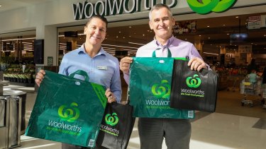 Woolworths Group chief executive Brad Banducci, right, and Woolworths Stores director Michael James with the company's new range of bags. 