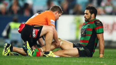 Concern: Souths star  Greg Inglis receives treatment during Friday's match against Canterbury before being forced to leave the field.