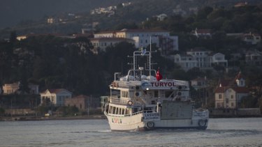 A ferry carrying migrants from Greece to Turkey leaves the port of Mytilene in the island of Lesbos, on Monday.
