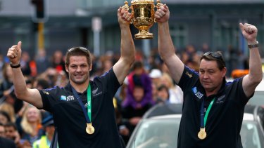 Going out on a high: All Blacks captain Richie McCaw and coach Steve Hansen hold the Webb Ellis Cup aloft during welcome home celebrations earlier this month.