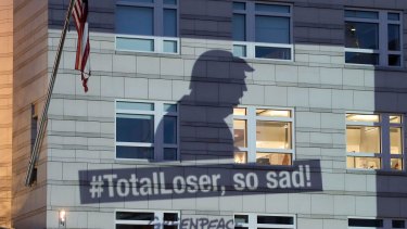 A Greenpeace image showing the shadow of US President Donald Trump is projected onto the facade of the US embassy in Berlin on Friday.