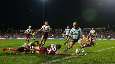 On the attack: Brett Stewart comes up just short against the Sharks.