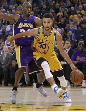 New guard: Curry drives past Bryant.