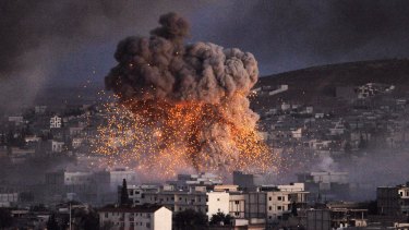 An explosion rocks the Syrian town of Kobane during a battle between Islamic State and the Kurdish forces last year.