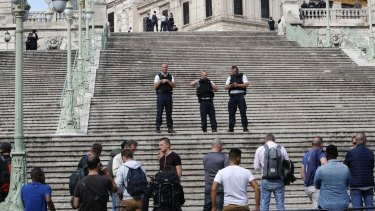 French police officers block access on the stairs leading to Marseille's main train station.