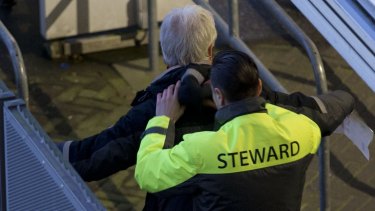 A steward frisks a soccer fan as he enters the stadium ahead of the international friendly soccer match between The Netherlands and France in Amsterdam on Friday. Security has been stepped up across Europe after the Brussels attacks.