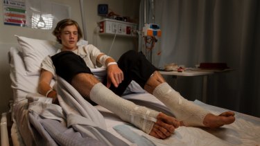 Still in shock: Sam Kanizay's wounds were seeping blood at Dandenong Hospital on Sunday, 18 hours after he emerged from the bay at Brighton with bloody legs, possibly by tiny bay creatures.