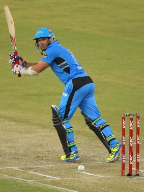 Brad Hodge, who top-scored for the Strikers, flicks a ball to the boundary.