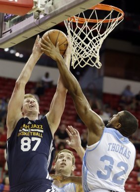 Taste of the big time: Brock Motum (left) looks for points for the Utah Jazz during the NBA summer league.