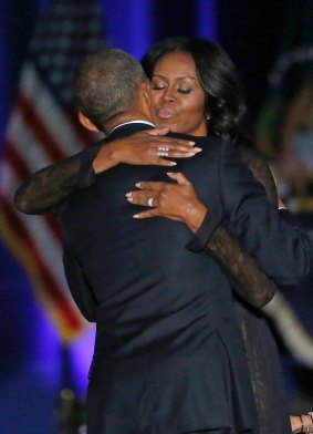 First Lady Michelle Obama hugs her husband Barack after his address.