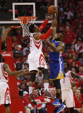 Denied: Festus Ezeli of the Golden State Warriors has his shot blocked by Dwight Howard.