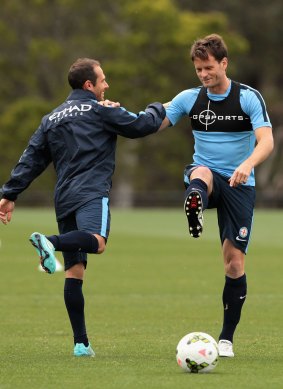 On the right track: Rob Wielaert (right) stretches during a Melbourne City training session. 