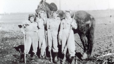 Peggy Williams (second from right), Land Army girl in WWII.