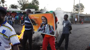 Supporters of opposition leader Raila Odinga protest the results on Monday.