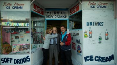 George Poulos with his daughter, Aphrodite, and son, Nik, outside his milk bar in 2014. "It gave him something to do — to get up in the morning and do things."