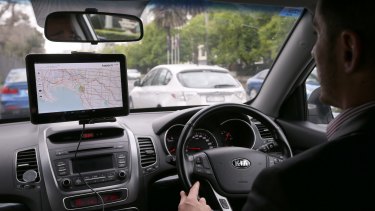 The tablet inside a connected vehicle gives the driver information about local traffic conditions.