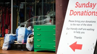 Items left in front of a Salvation Army store in Abbotsford on Monday in front of a sign that asks people to drop goods at the back. 