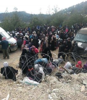 Syrians wait to enter Turkey this week.