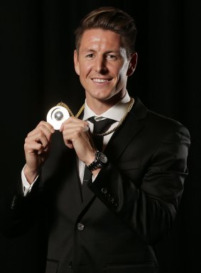 Nathan Burns of Wellington Phoenix poses with the Johnny Warren Medal.