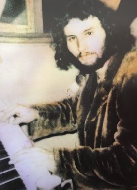 Tim, aged 21, at his piano.