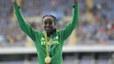 Smashed the world record: Ethiopia's Almaz Ayana celebrates winning the gold medal.