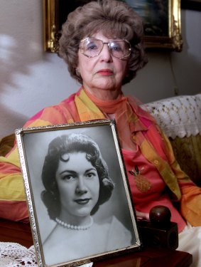 Herlinda de la Vina holds a portrait of her niece, Irene Garza, the 25-year-old Texas schoolteacher and beauty queen in Edinburg, Texas. 