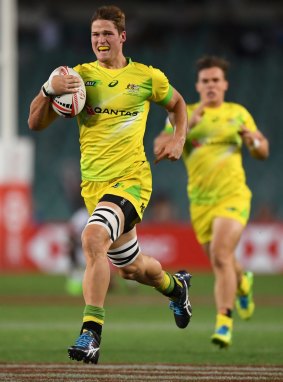 Tim Anstee of Australia runs with the ball to score a try during their mens Pool D match against the US.