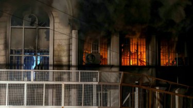 Smoke billows from the windows of the burning Saudi embassy in Tehran following a protest by Iranian activists.