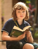 Ten-year-old Madeleine Hayen has a kindle, but still goes to Glebe Library once a week to pick up a new batch of books.