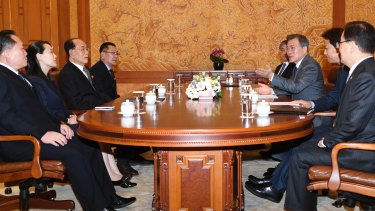 South Korean President Moon Jae-in, third from right, speaks to Kim Yo Jong, second from left, sister of North Korean leader Kim Jong Un, and North Korean delegation during a meeting at the presidential house in Seoul.