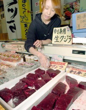 Yoko Yoshimura arranges cuts of raw whale meat at her shop at a port in Shimonoseki, Japan.