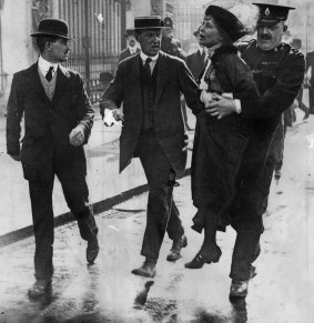 Suffragette leader Emmeline Pankhurst is arrested outside Buckingham Palace.