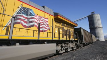 An American flag is displayed on Union Pacific Corp. train as it is loaded with coal at the Savage Industries Co. processing facility in Price, Utah, on Friday, May 27, 2016. Power-plant demand for gas has been breaking seasonal records amid low prices and a record shutdown of coal plants last year to meet stricter environmental regulations, government data show. Photographer: George Frey/Bloomberg