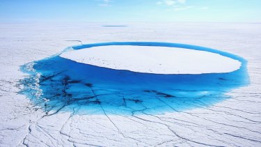 Water lies on part of the glacial ice sheet that covers about 80 per cent of Greenland.