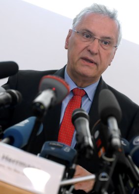 Bavaria's Interior Minister Joachim Herrmann speaking at a news conference.