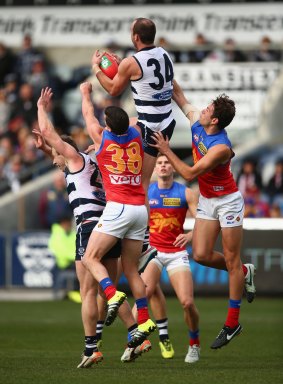 Josh Walker leaps for a mark during the Cats' win.
