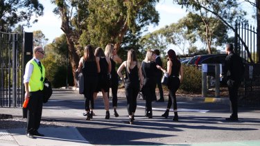 Mourners arrive for Patrick Cronin's funeral at Whitefriars College in Donvale.