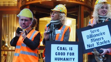 Australian anit-coal protesters stand outside the Hotel California in Paris.