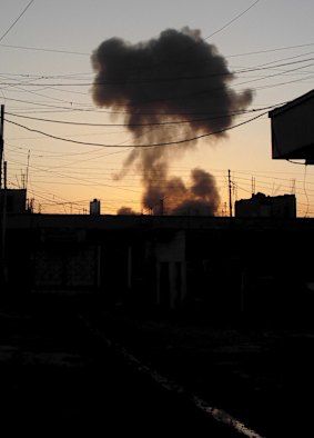 Smoke rises after a bomb attack in the city.