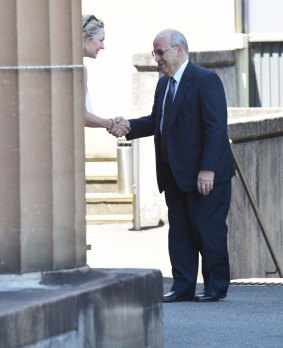 Margaret Cunneen shaking hands with Eddie Obeid outside the NSW Supreme Court in Darlinghurst in February 2016.