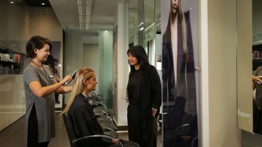 Sandy Chong (right), chief executive of the Australian Hairdressing Council, at her salon, Suki.