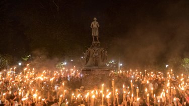 Torch-bearing white nationalists rally around a statue in Charlottesville.