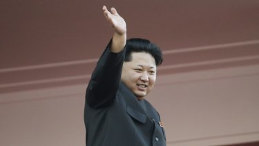 North Korean leader Kim Jong-un waves at a parade in Pyongyang, North Korea.