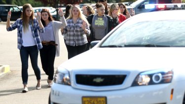 Students and staff are evacuated after a deadly shooting.