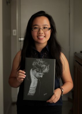 Nadia Hendryani holds a picture of One Direction's Niall Horan.