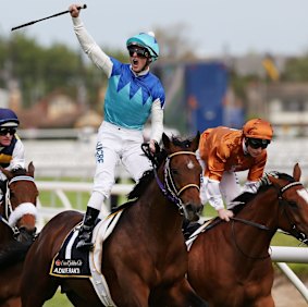 Zac Purton salutes after piloting Admire Rakti home in the Caulfield Cup.