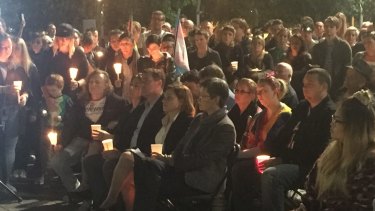 Mourners honour those slain in the Orlando nightclub massacre at a vigil in Brisbane's Reddacliff Place.