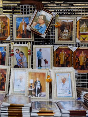 A man sells portraits of King Bhumibol Adulyadej on the street in Bangkok on Friday.